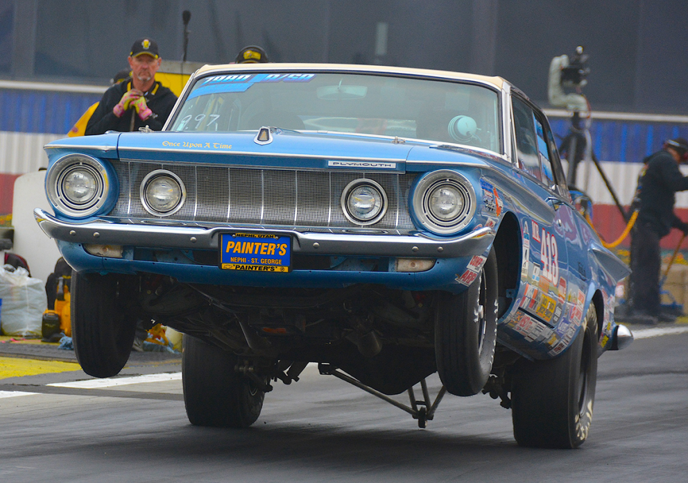 Vehicle on two wheels on a drag strip