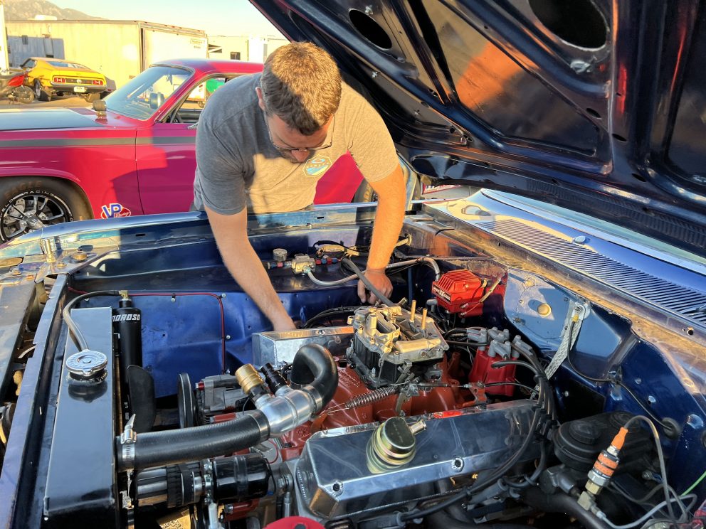 man working on car