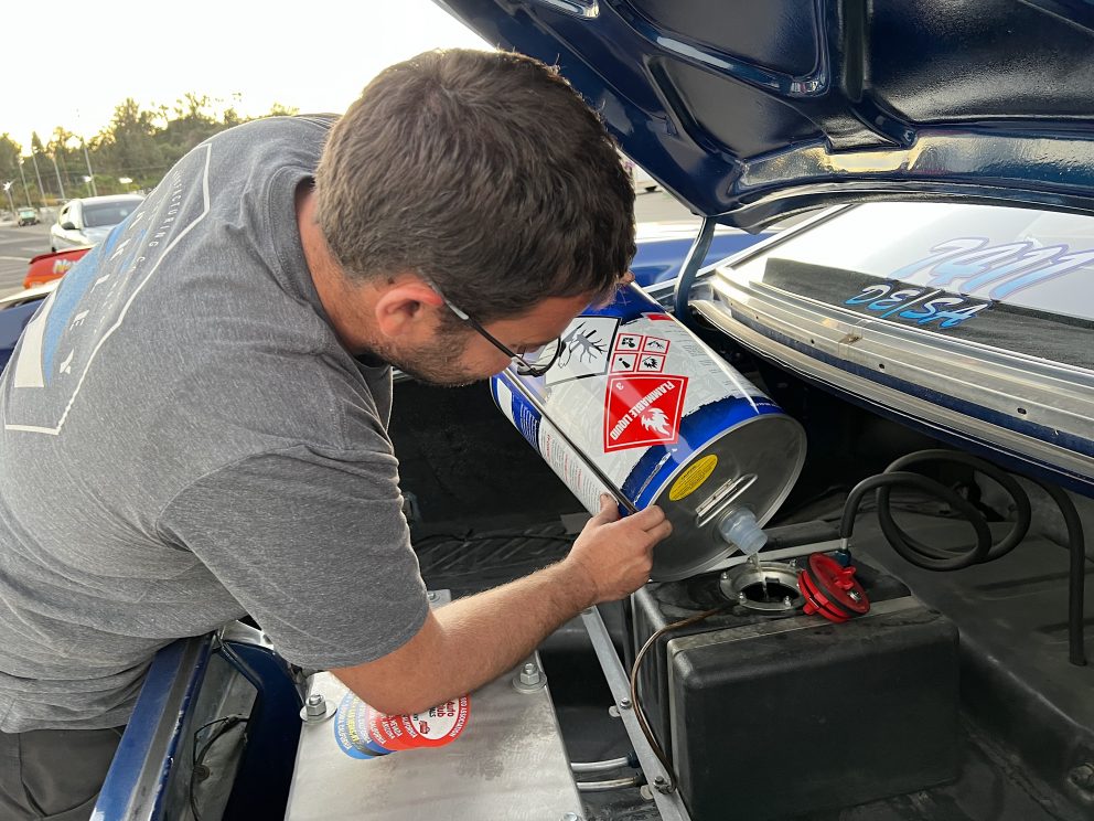 Man working on race car