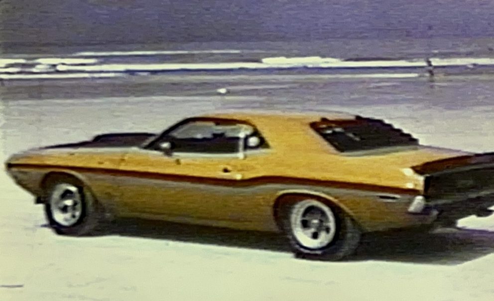 Dodge vehicle sitting on the beach