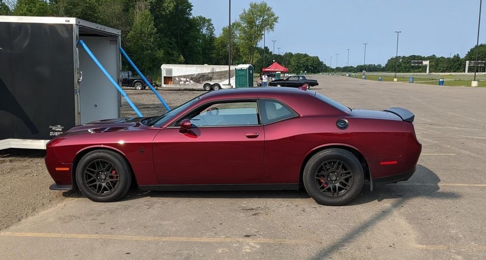 Dodge vehicle being loaded into a trailer