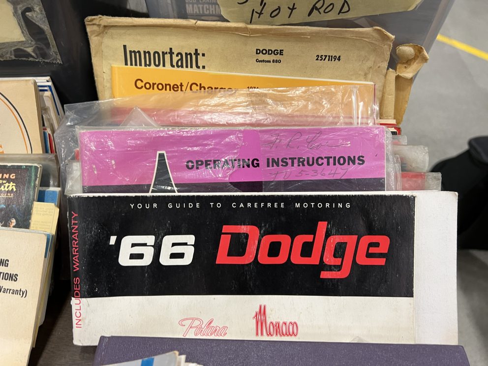 vintage user manuals on display at a swap meet