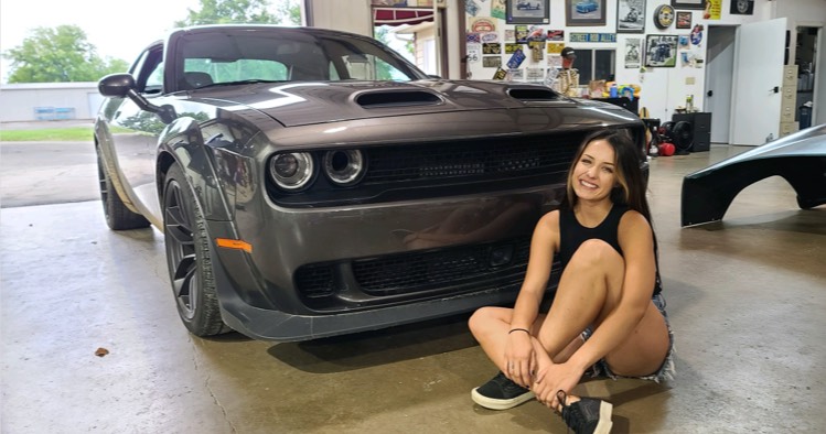 Alex Taylor in front of one of her ride