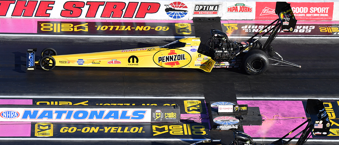 Two top fuel dragsters racing at Vegas nationals