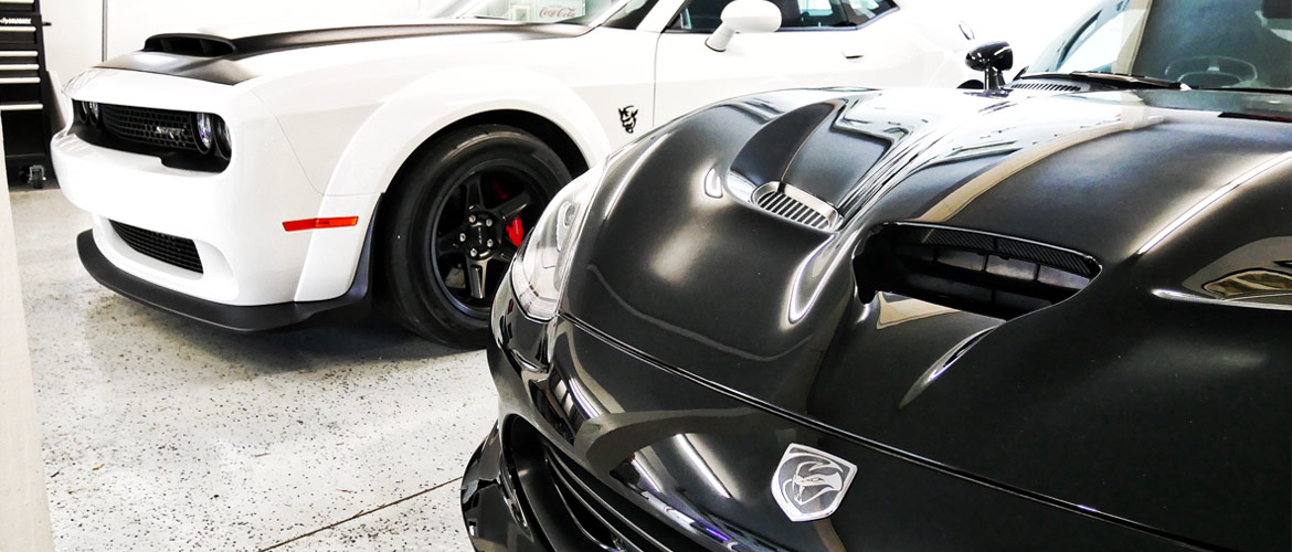 Black Dodge Viper and White Dodge Challenger Demon