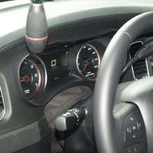 nside, the Pursuit is the only Charger offered with a column-mounted shift lever. All others are mounted to a central floor console. This gives space for floor-mounted police radio and computer accessories. Note the certified 160 mph speedometer and 7000 rpm tachometer.
