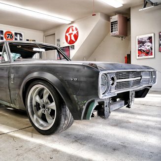 Old Dodge challenger primed in a shop