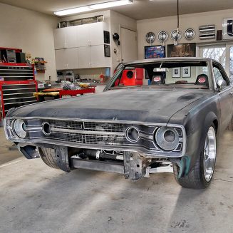 Old Dodge challenger primed in a shop