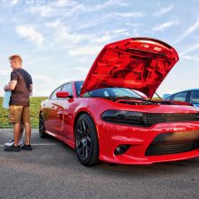 Red Dodge Charger with hood popped