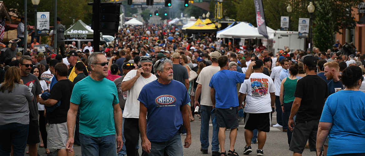 people walking down a bust street