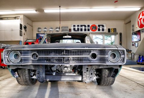 Primered Dodge Challenger at shop getting restored