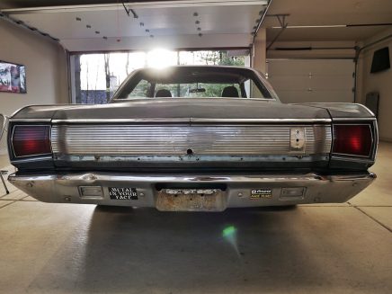 Primered Dodge Challenger at shop getting restored