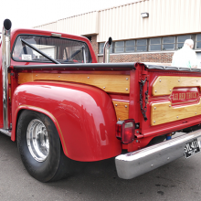 rear side view of a lil red truck