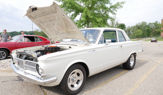 older white car with hood popped