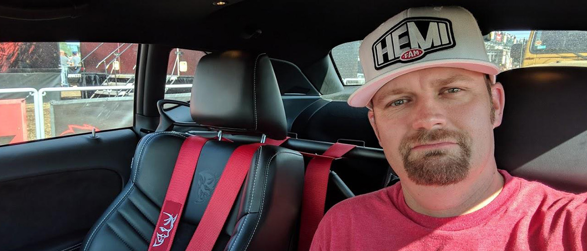 man taking a selfie with a hemi fan hat on