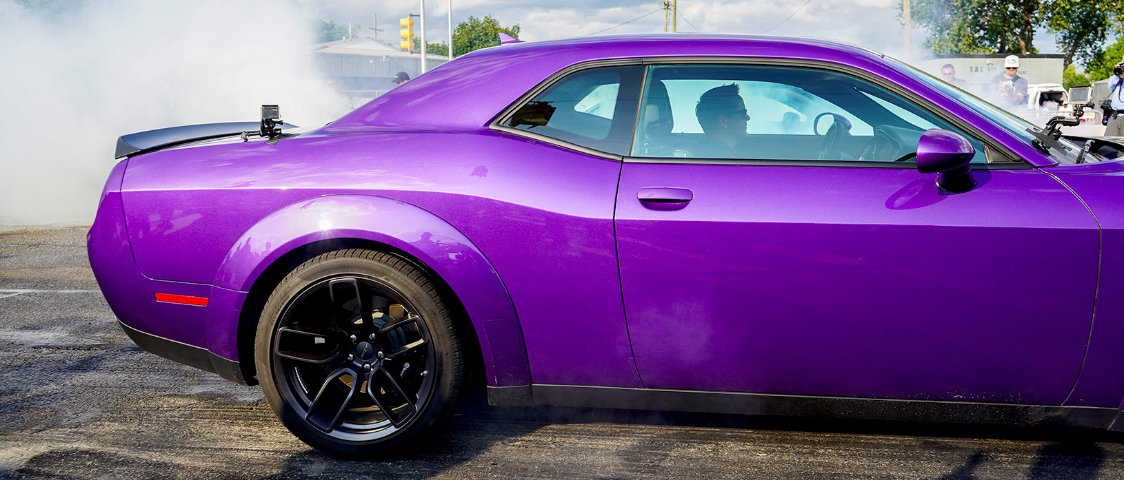 Matt D'Andria racing a plum crazy Challenger