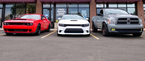 Three Dodge cars lined up