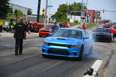 Blue Charger Hellcat doing a burnout at Roadkill Nights