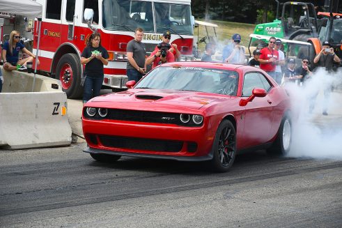Red Hellcat doing a burnout at Roadkill Nights
