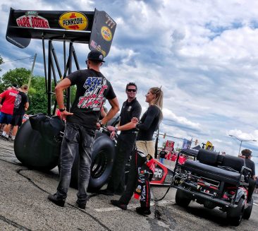 Leah Pritchett talking to fans before racing her top fuel dragster at Roadkill Nights