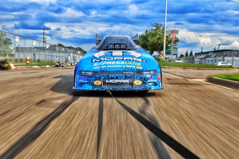 Matt Hagan's funny car being pulled to the starting line at Roadkill Nights