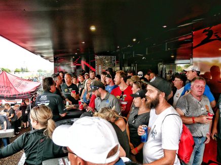 Fans enjoying the Dodge hospitality trailer at Roadkill Nights