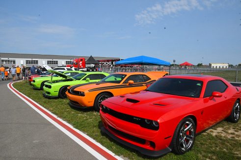 Row of Dodge vehicles at the car show at Roadkill Nights