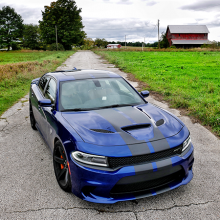 Blue 2018 Dodge Charger SRT Hellcat parked on a rural farm