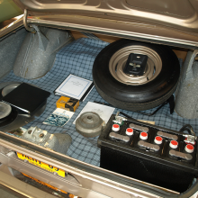 The trunk of this all-original, un-restored 1965 A990 showcases the huge, factory-installed battery