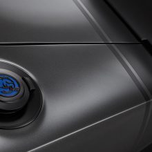 The Satin Black fuel door of the 1968 Dodge “Super Charger” Concept is embellished with a custom-milled aluminum “Hellephant” medallion. Vehicle graphics and badging are Satin Black vinyl decals, including the classic tail stripes at the rear.