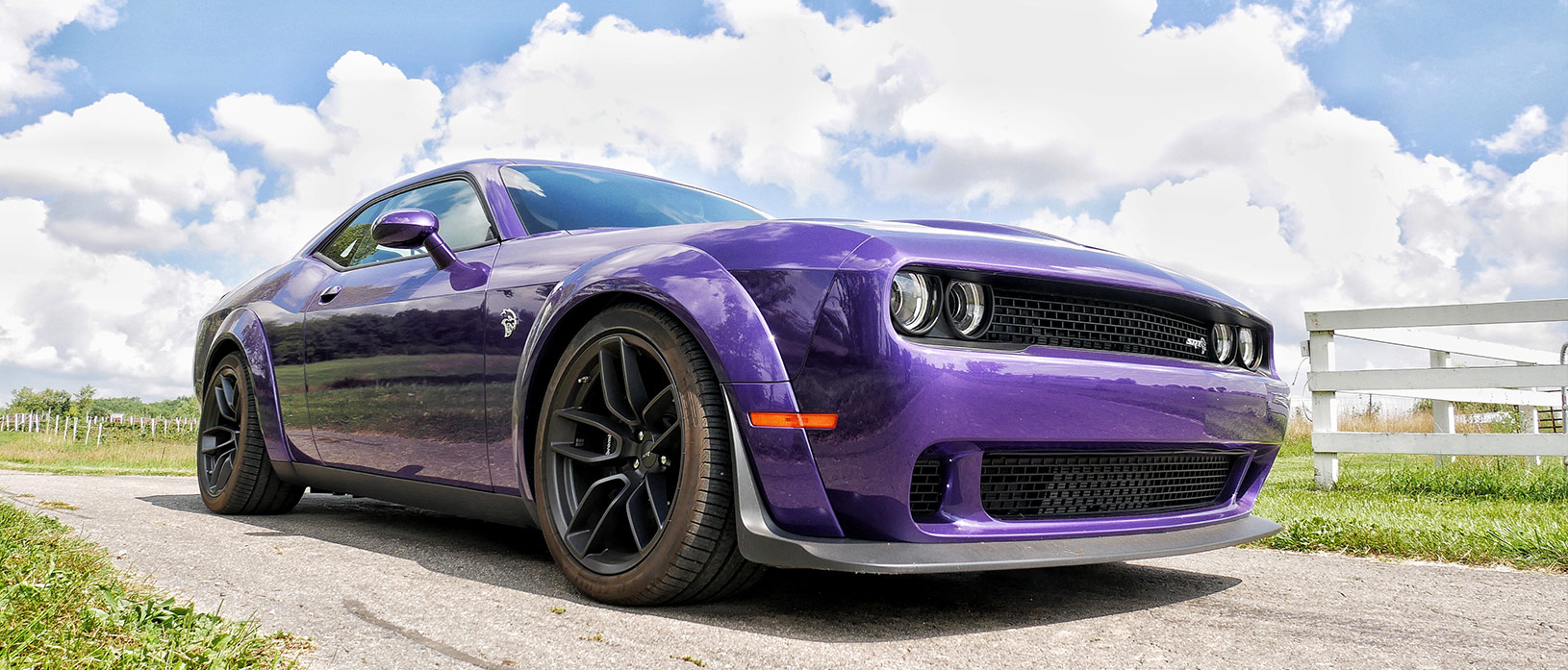 Plum Crazy Challenger Hellcat parked in the country