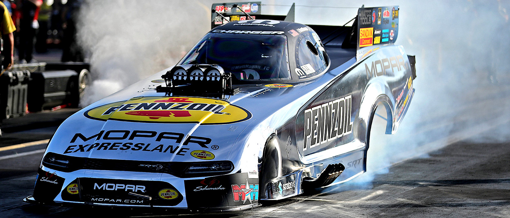 Matt Hagan's Pennzoil Mopar Express Lane Dodge Charger SRT Funny Car doing a burnout