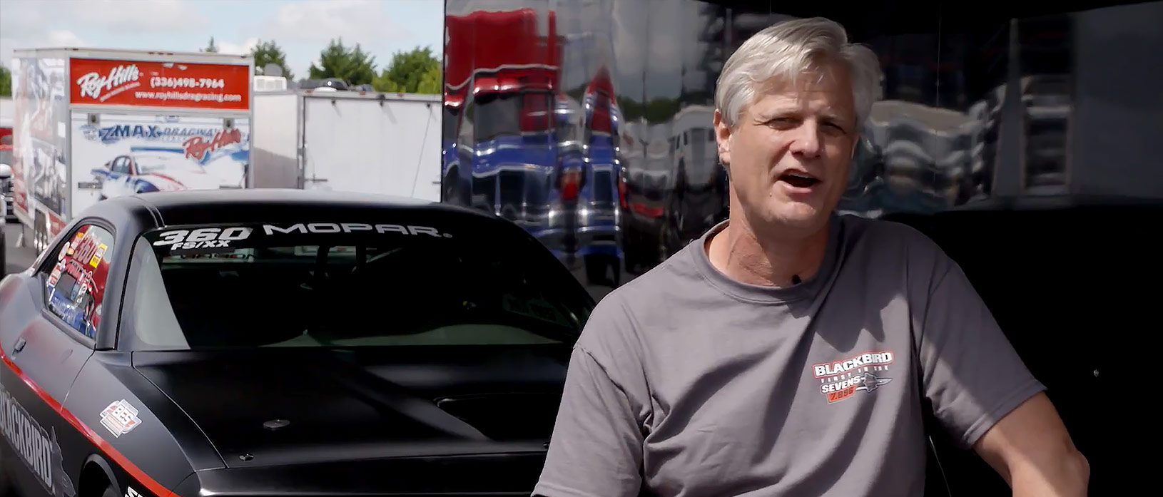 Geoff Turk sitting in front of his Challenger Drag Pak