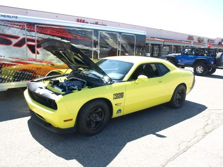 The 1320 Concept rolls on 18x7.5-inch steel wheels from the Dodge Charger Police Pursuit parts bin. The front tires are P225-60R18 black walls with Mickey Thompson P305-45R18 ET Street drag radials out back. The black rims and exposed chrome lug nuts conjure the 1969-1/2 A12 Six Pack Super Bee.