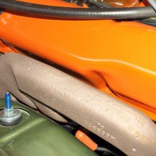 The passenger-side exhaust manifold is a flatter version of the standard 440 Magnum’s upswept design. Switching to free-flowing headers typically added 25 to 35 horsepower but required brutal cutting of inner fender walls for pass-through.