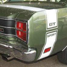 Like every member of the Dodge Scat Pack, the 1969 Dart 440 GTS came standard with a Bumble Bee stripe for quick identification. The sinister red-lettered GTS trunk emblem stands for GT Sport. Note the standard issue chromed exhaust tips, a Package Car first.