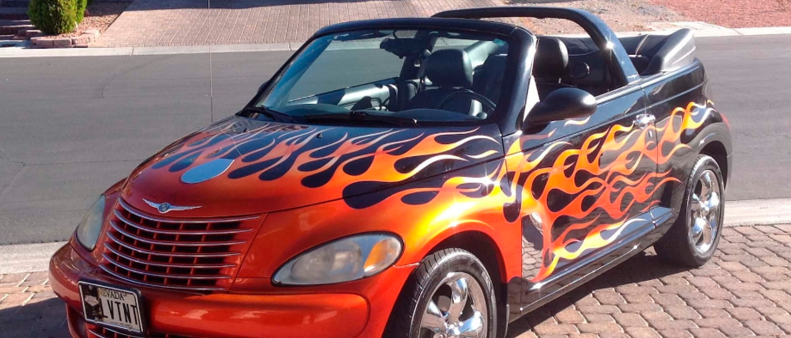 Customized PT Cruiser. Black convertible with red and orange flames