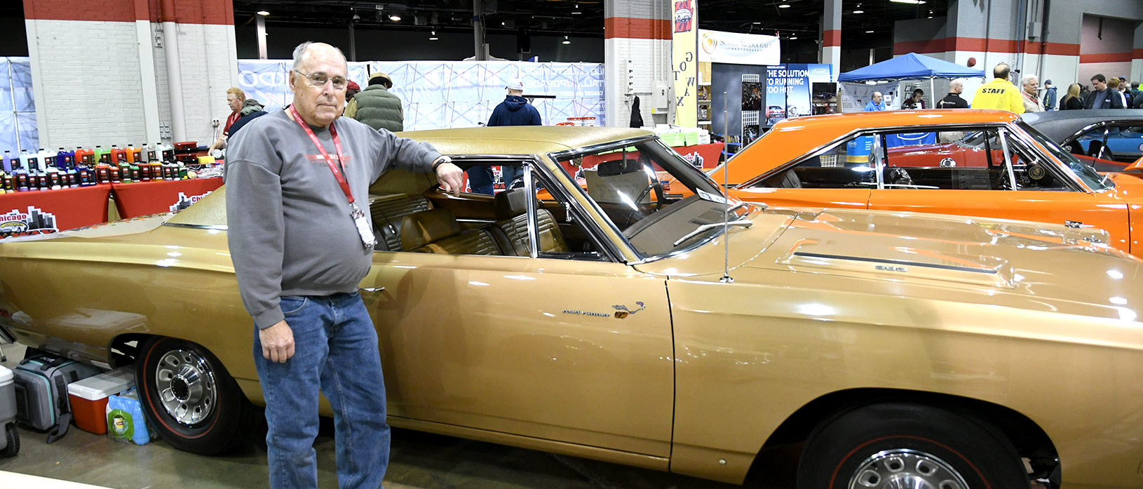 John Manship standing beside his 1969 Plymouth Road Runner at MCACN