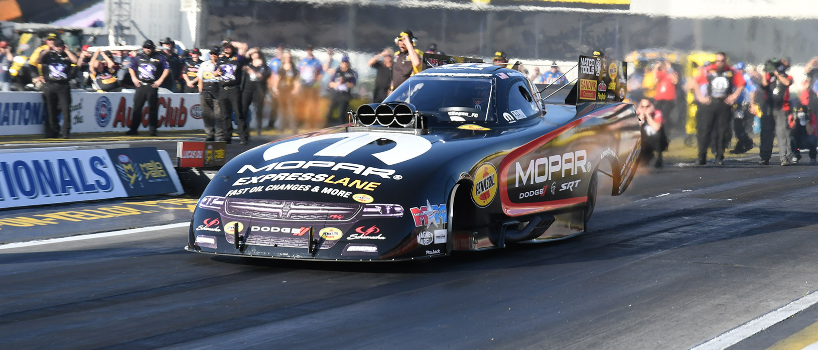 Matt Hagan racing his funny car down the track