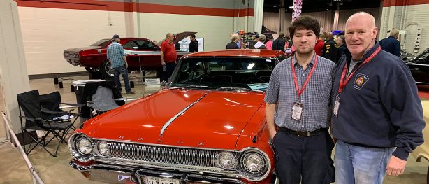 Mike and his son standing in front of their 1964 Dodge Polara 500