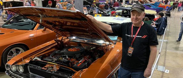 Bill Chambers standing beside his 1970 Challenger R/T convertible