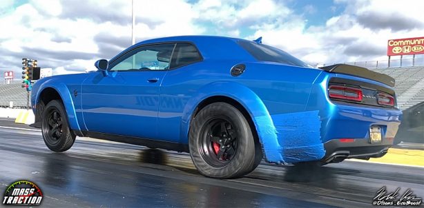 Blue Dodge Demon racing down the track