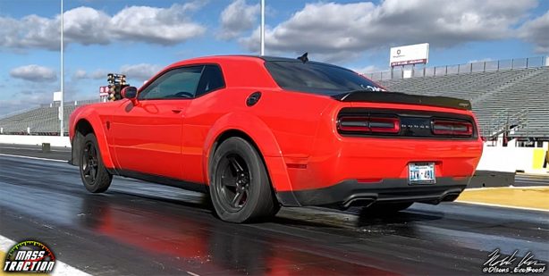 Red Dodge Demon racing down the track