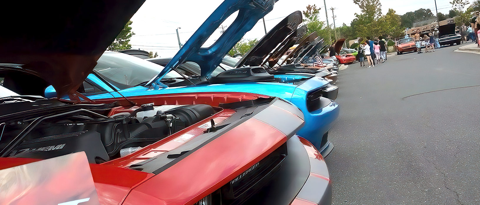 Row of Dodge Challengers at a car show