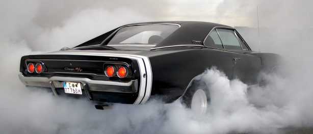 Black Dodge Challenger R/T doing a burnout