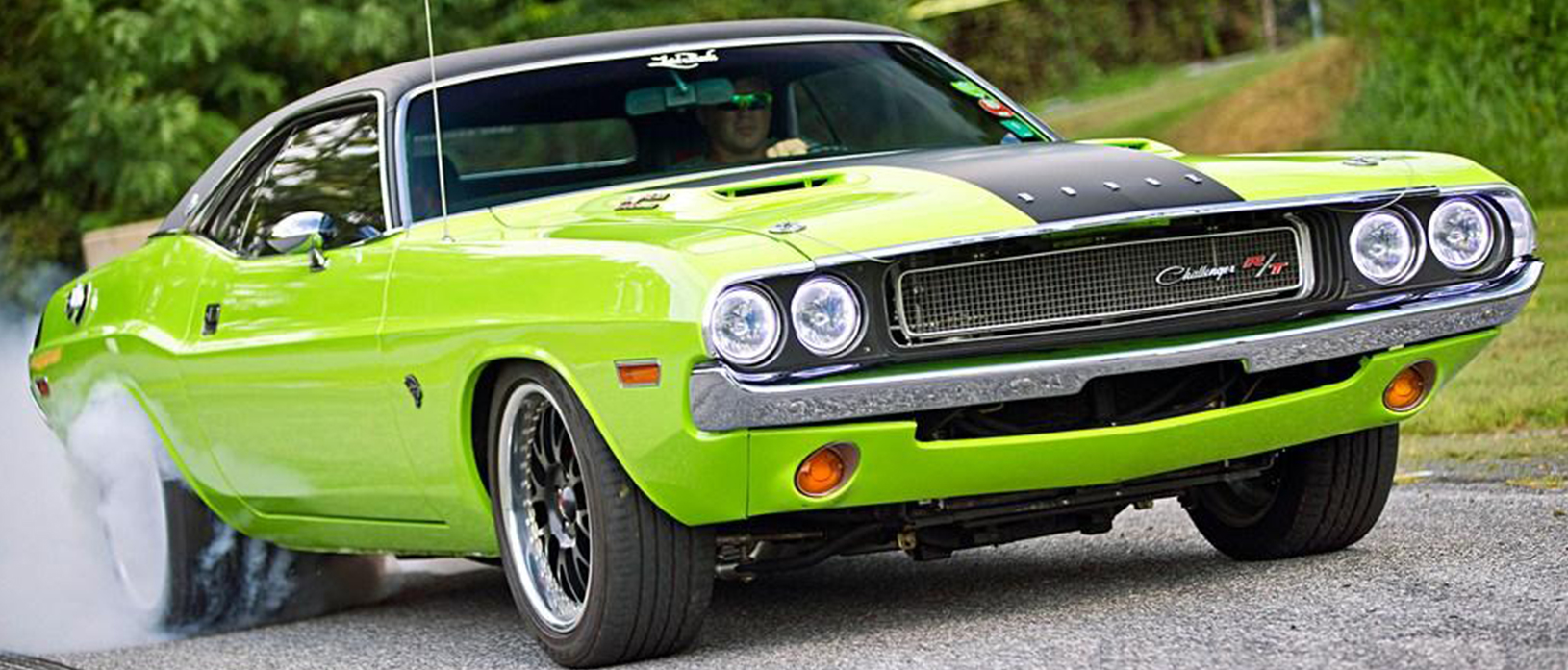 Green Dodge Challenger R/T with flat black hood stripe