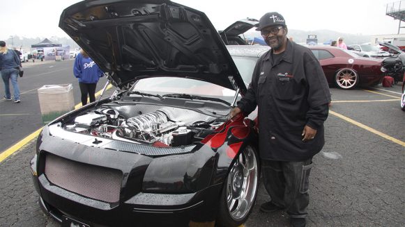 Dodge Charger owner standing beside his car at SpringFest 13