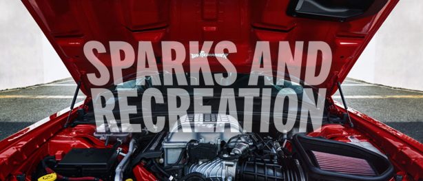HEMI engine inside a red Challenger with the words "Sparks and Recreation" over the photo