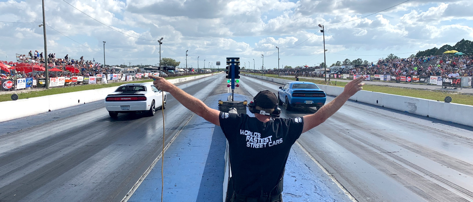 2 Challengers racing down the track at NMCA Muscle Car Mayhem