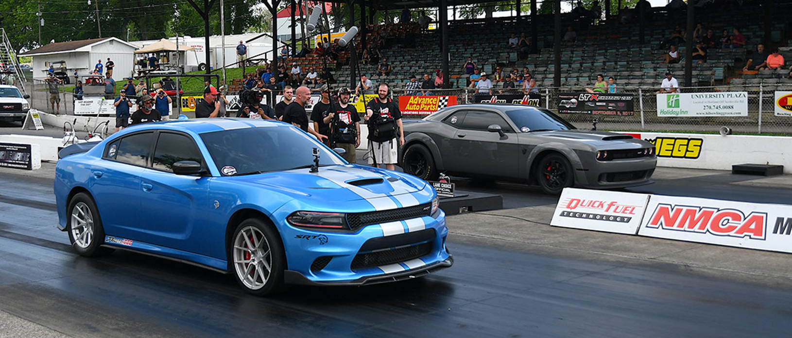 Blue Hellcat racing a gray Demon